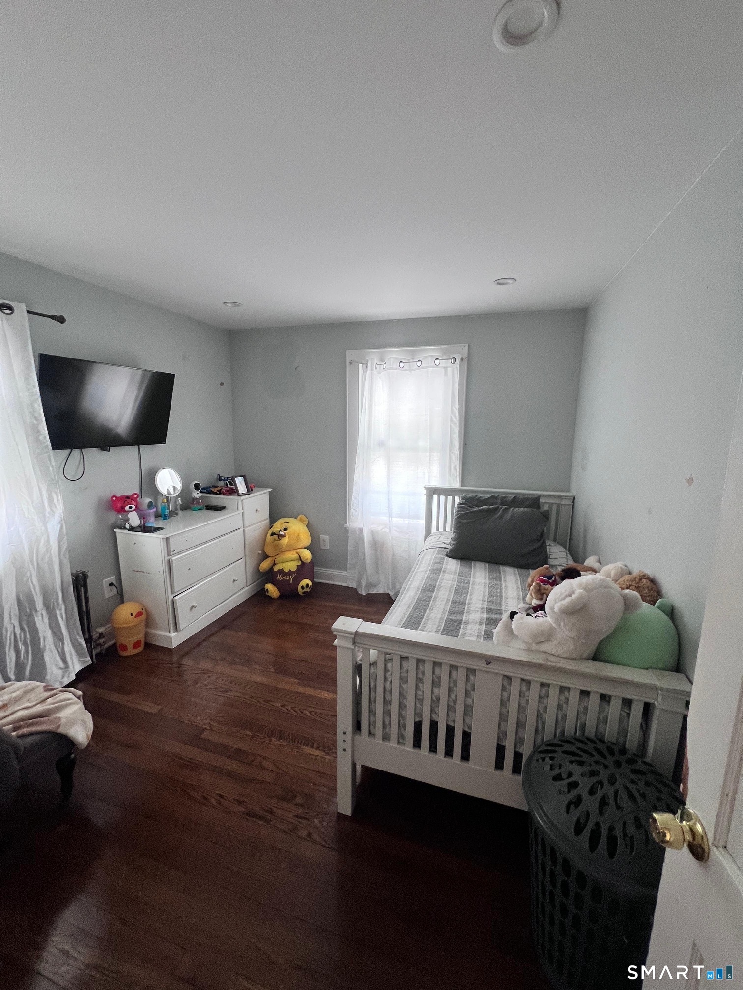 3461 East Main Street Bridgeport, CT 06606 - Photo 31 of 68 a bedroom with bed and window