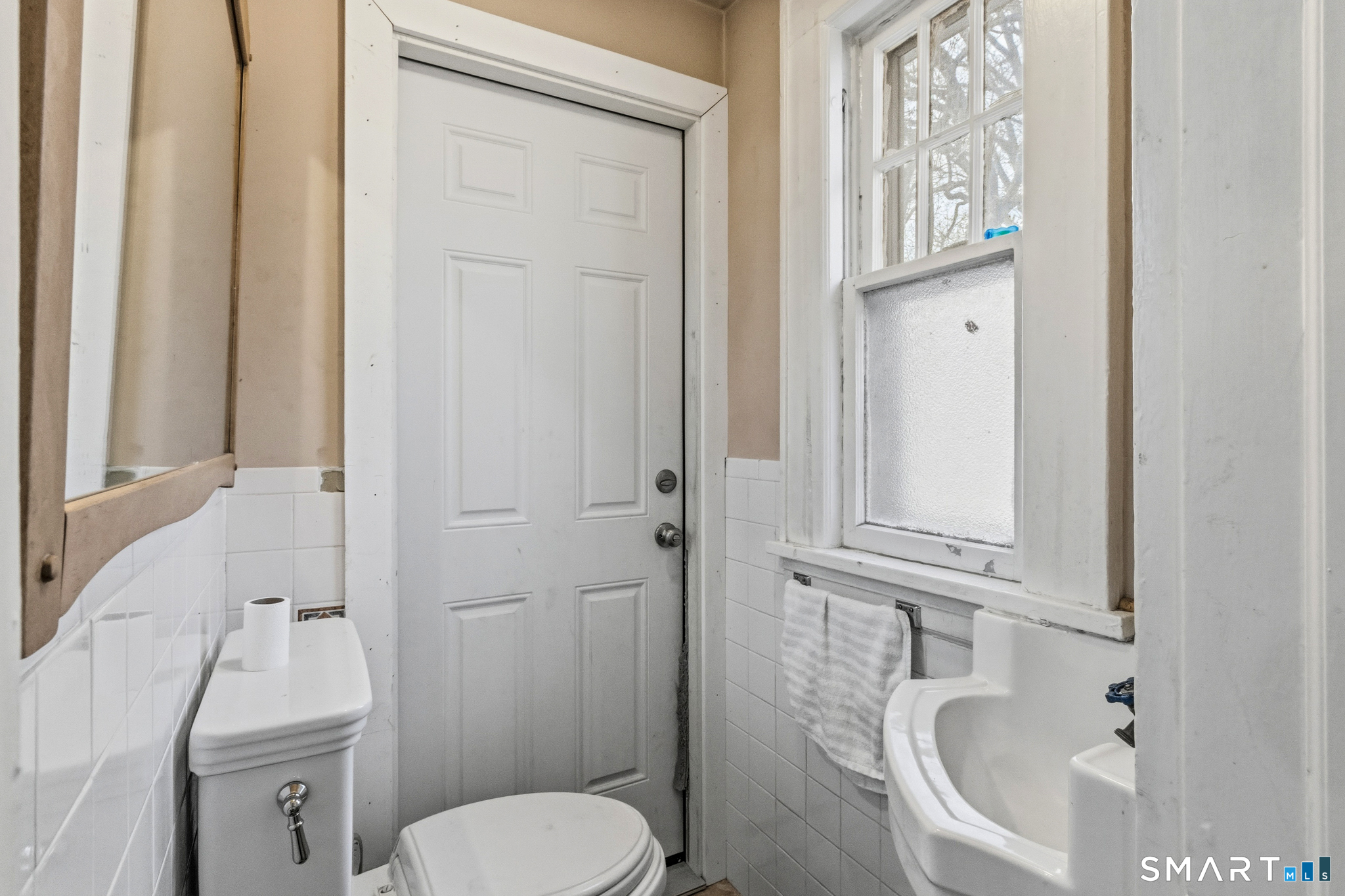 3461 East Main Street Bridgeport, CT 06606 - Photo 34 of 68 a bathroom with a sink a toilet and shower