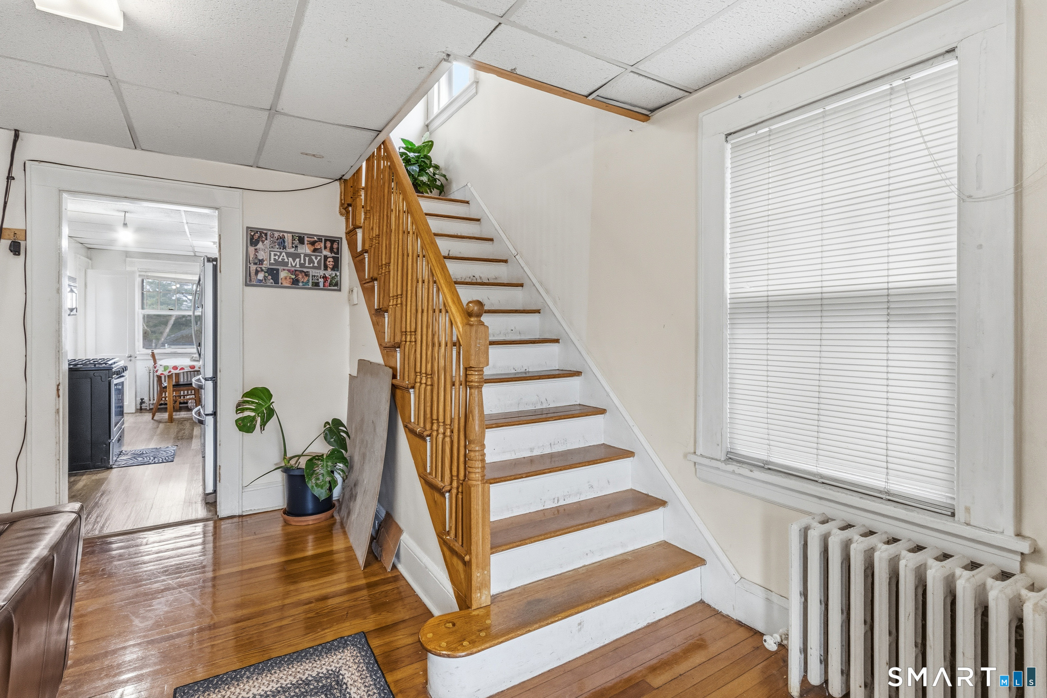 3461 East Main Street Bridgeport, CT 06606 - Photo 36 of 68 a view of entryway with wooden floor and stairs