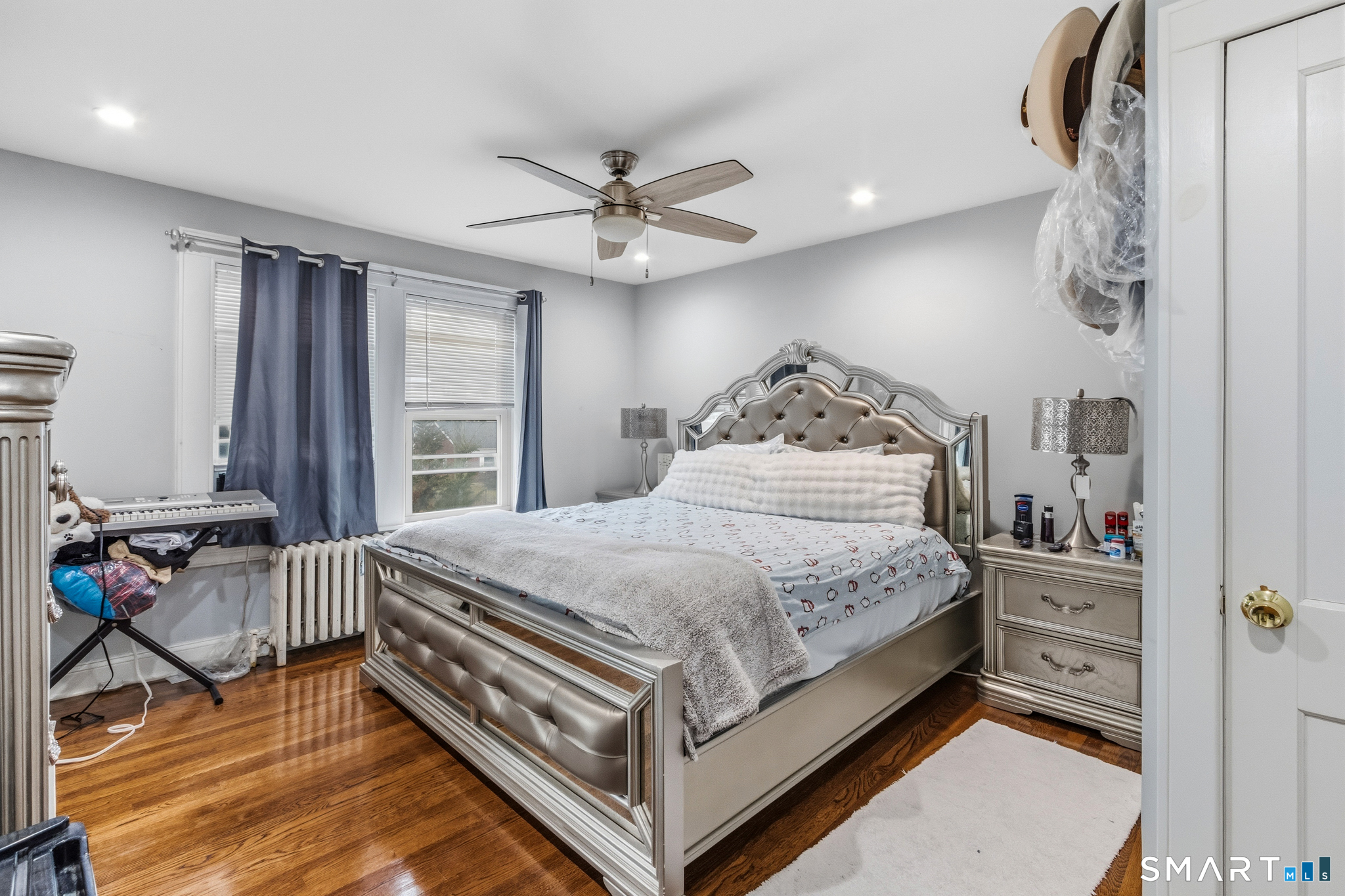3461 East Main Street Bridgeport, CT 06606 - Photo 46 of 68 a bedroom with a bed and a chandelier