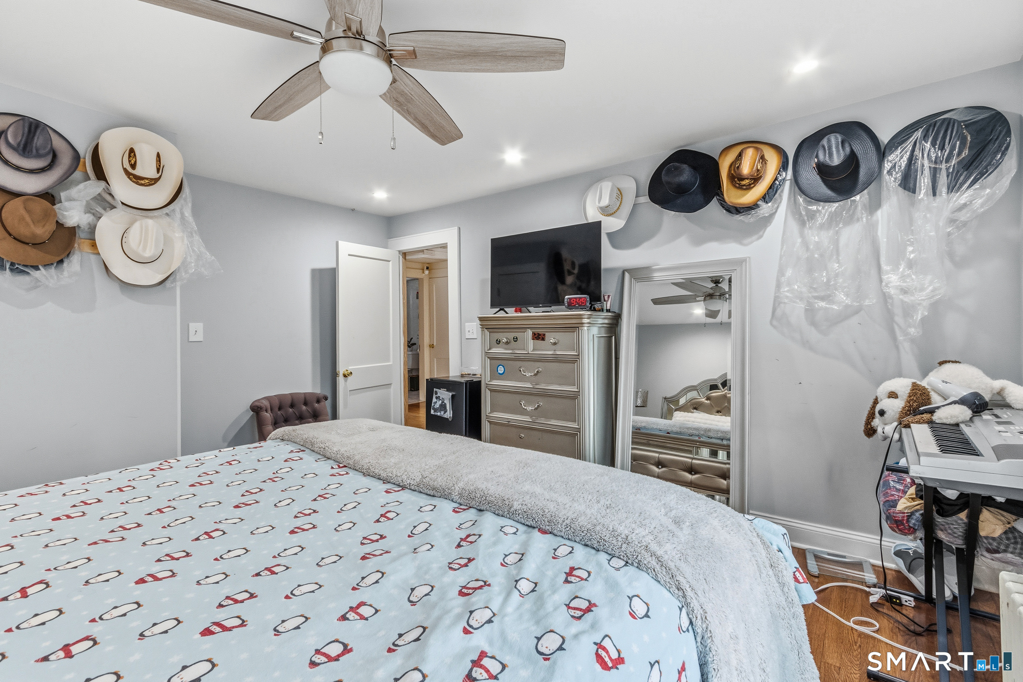 3461 East Main Street Bridgeport, CT 06606 - Photo 48 of 68 a bedroom with a bed and a television in it
