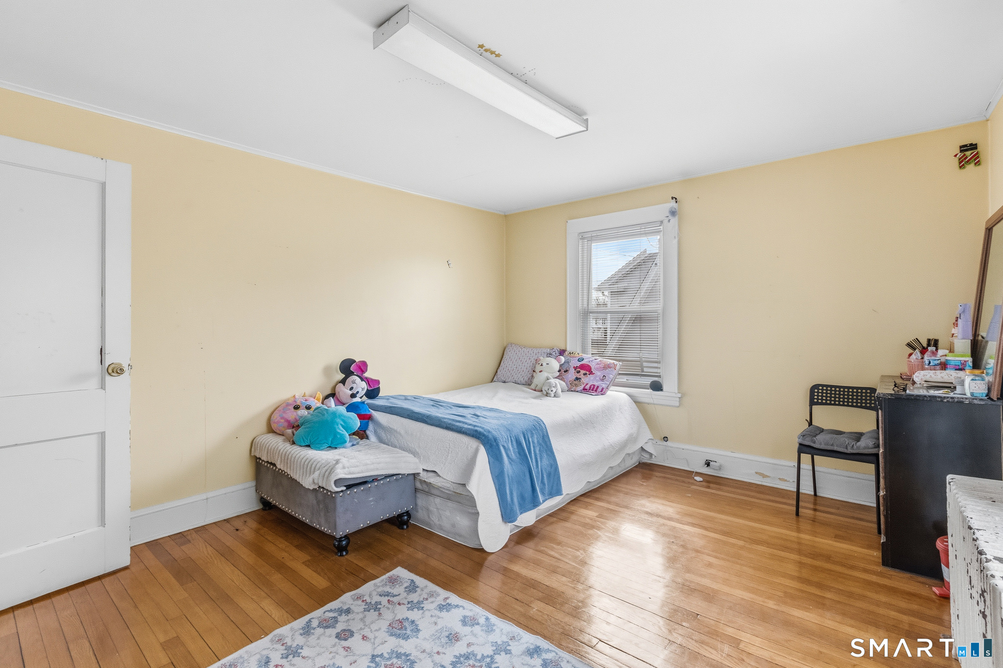 3461 East Main Street Bridgeport, CT 06606 - Photo 52 of 68 a bedroom with a bed and window