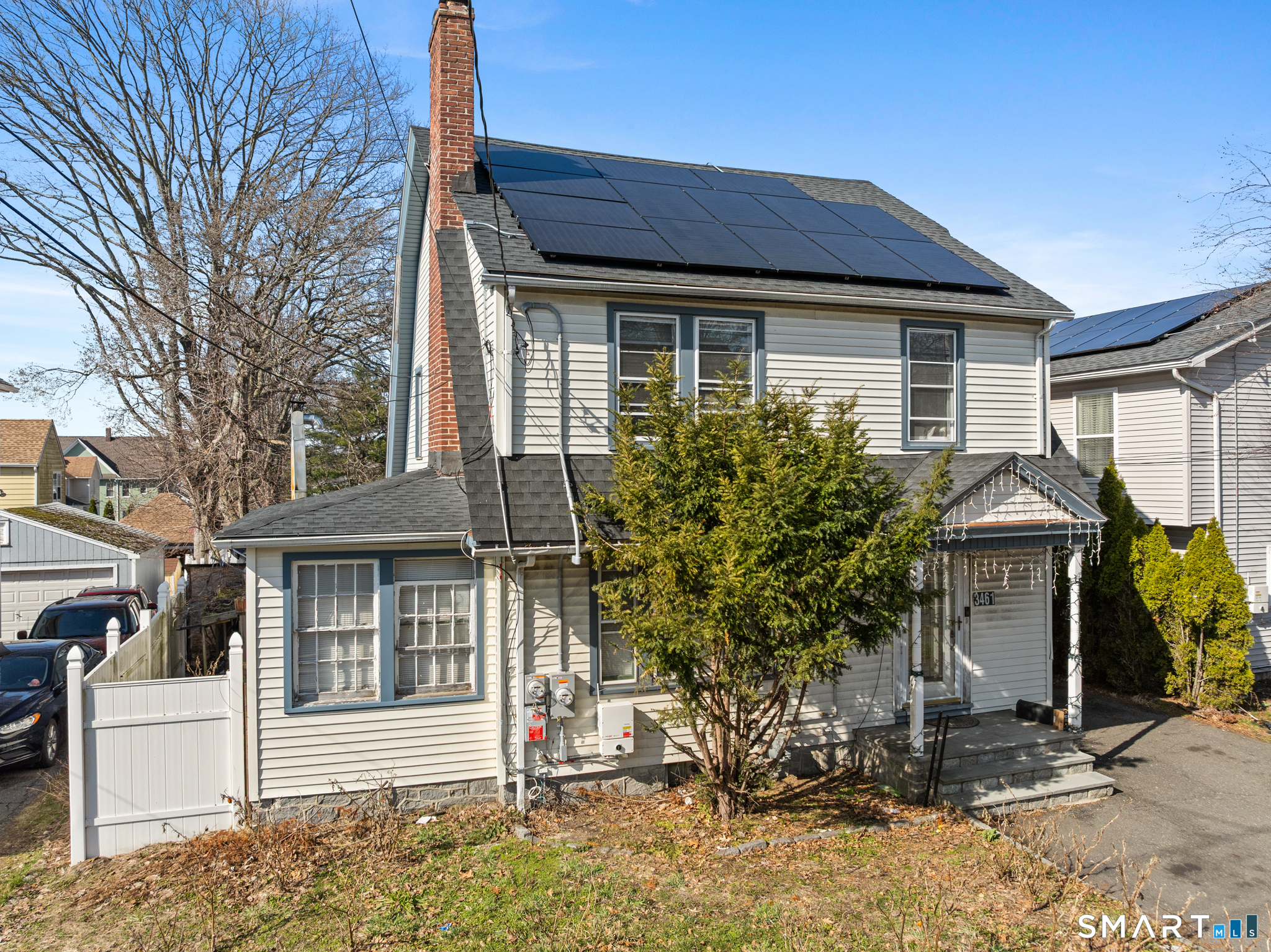3461 East Main Street Bridgeport, CT 06606 - Photo 6 of 68 a house that has a tree in front of the house