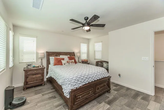 a bedroom with a bed and window