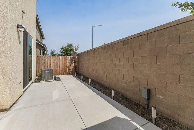 a balcony with table and chairs