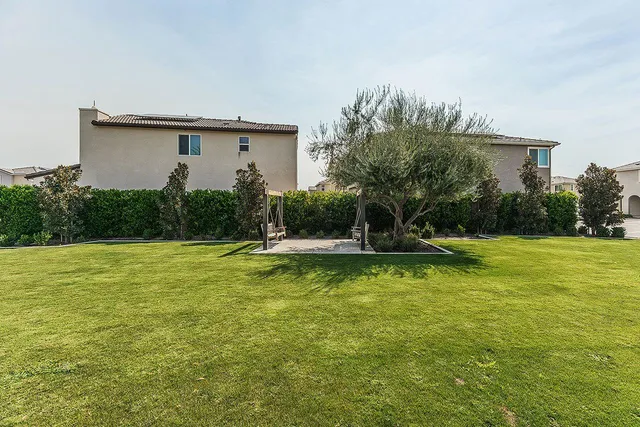a view of a backyard with green space