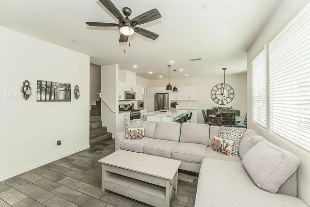 a living room with furniture and a large window