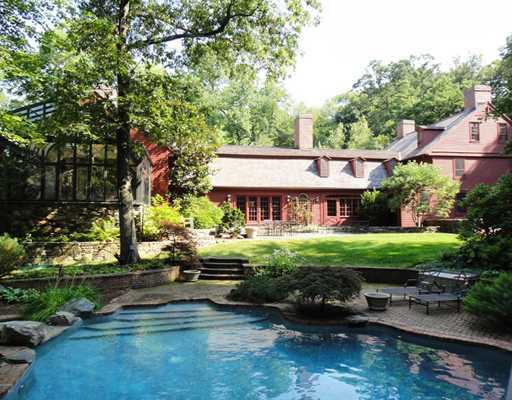 769 Hollow Tree Ridge Road Darien, CT 06820 - Photo 1 of 15 a front view of a house with garden