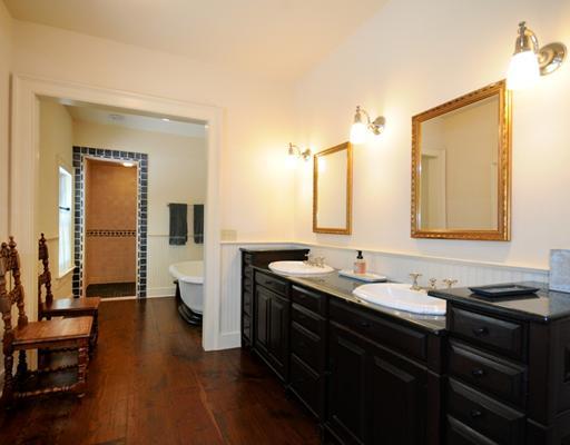 769 Hollow Tree Ridge Road Darien, CT 06820 - Photo 11 of 15 a bathroom with a double vanity sink and a mirror