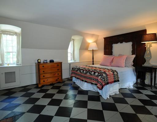 769 Hollow Tree Ridge Road Darien, CT 06820 - Photo 13 of 15 a bedroom with a bed and a black white checkered floor