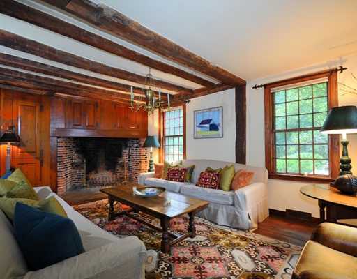 769 Hollow Tree Ridge Road Darien, CT 06820 - Photo 6 of 15 a living room with furniture and a fireplace