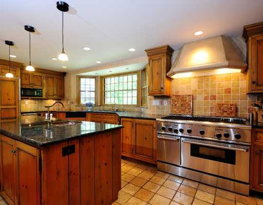 769 Hollow Tree Ridge Road Darien, CT 06820 - Photo 7 of 15 a kitchen with stainless steel appliances granite countertop a stove a sink and a refrigerator