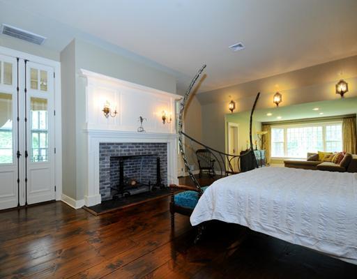769 Hollow Tree Ridge Road Darien, CT 06820 - Photo 10 of 15 a bed room with a fireplace and window