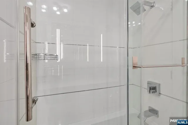 a kitchen with a table chairs and a refrigerator