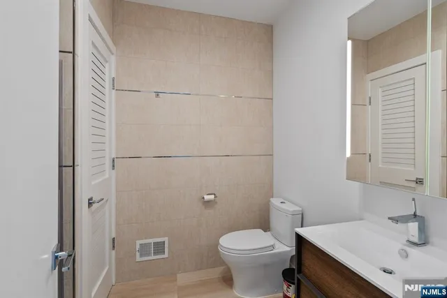 a view of hallway with wooden floor