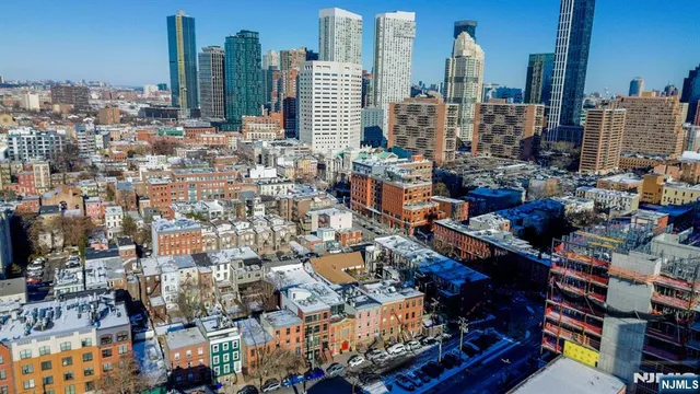 a bedroom with a bed and a dresser in it