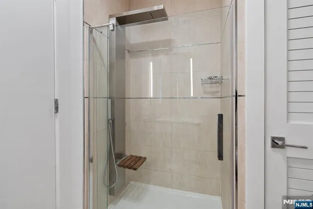 a front view of a building and car parked