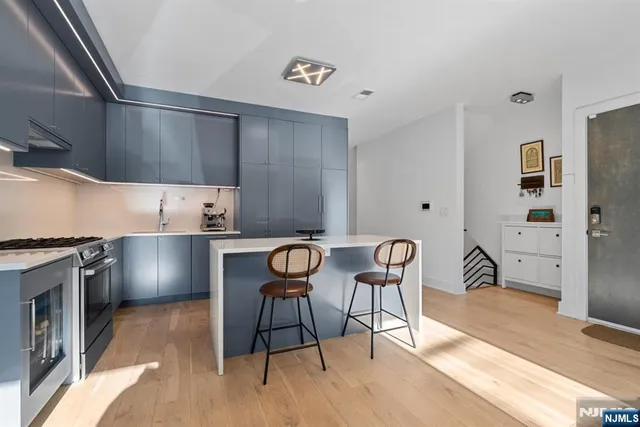 a view of a house with many windows and garden