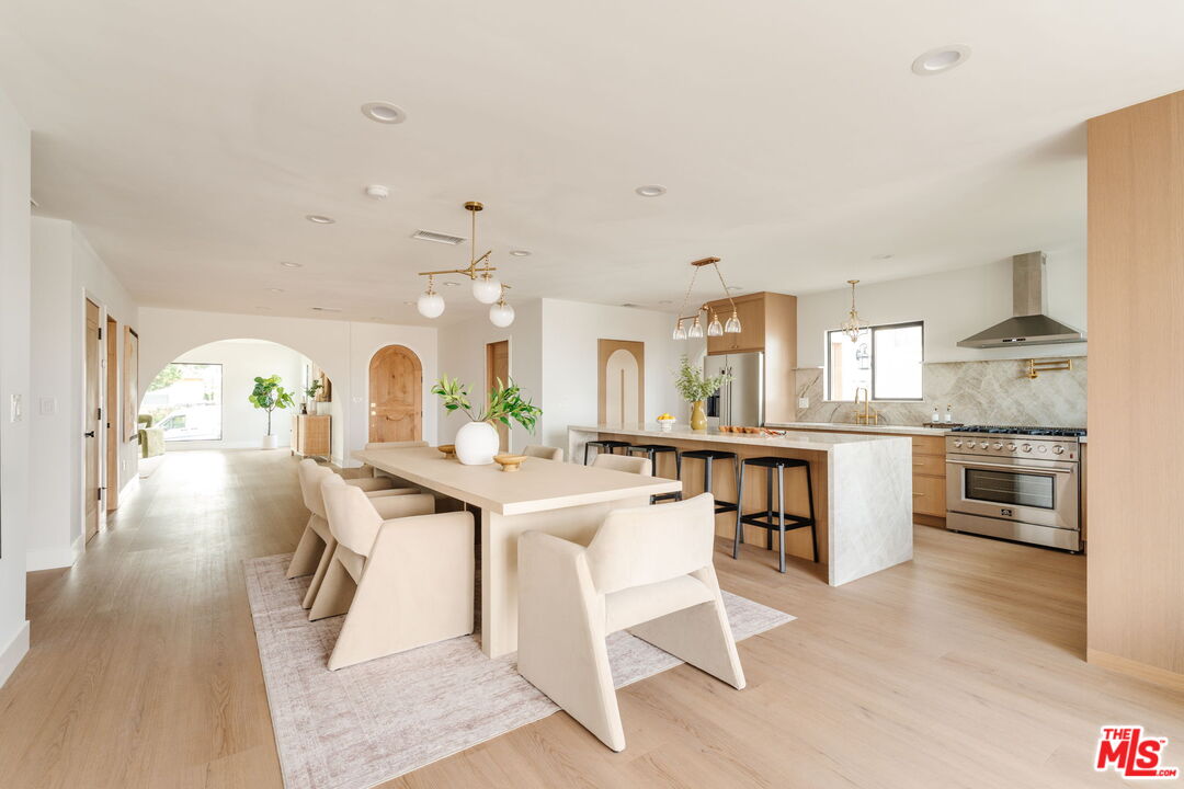 5168 Southridge Avenue Los Angeles, CA 90043 - Photo 11 of 74 a view of a kitchen with dining table and chairs