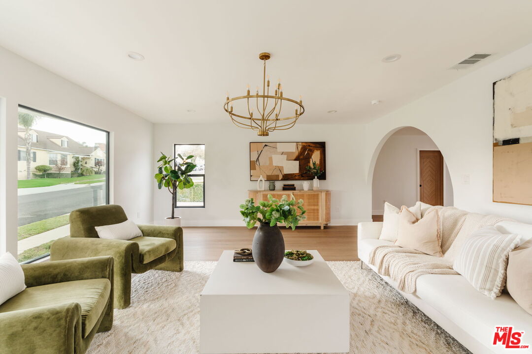 5168 Southridge Avenue Los Angeles, CA 90043 - Photo 20 of 74 a living room with furniture flowerpot and a window