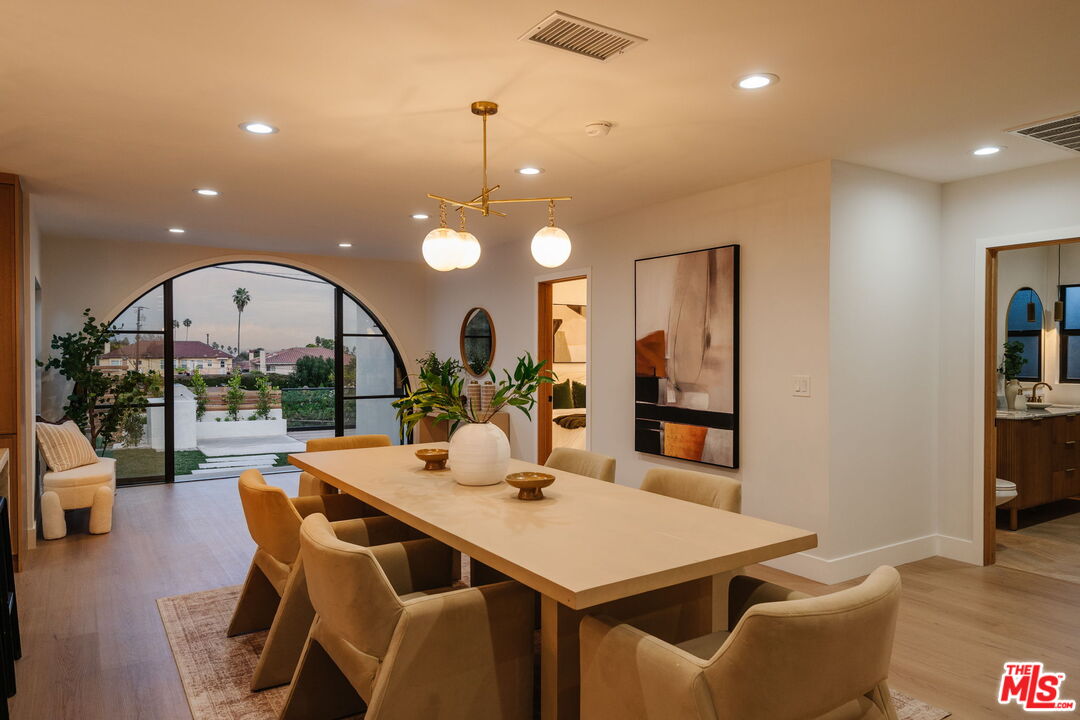 5168 Southridge Avenue Los Angeles, CA 90043 - Photo 2 of 74 a dining room with furniture a table and chairs