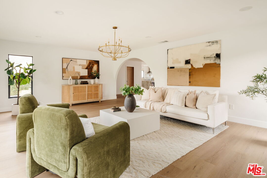 5168 Southridge Avenue Los Angeles, CA 90043 - Photo 21 of 74 a living room with furniture and a chandelier