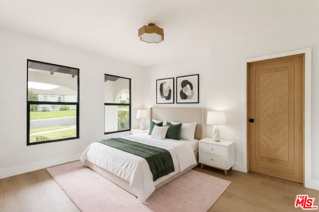 5168 Southridge Avenue Los Angeles, CA 90043 - Photo 41 of 74 a bedroom with a bed and a window