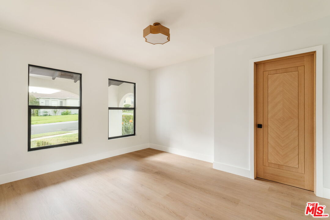 5168 Southridge Avenue Los Angeles, CA 90043 - Photo 42 of 74 a view of an empty room with window and wooden floor