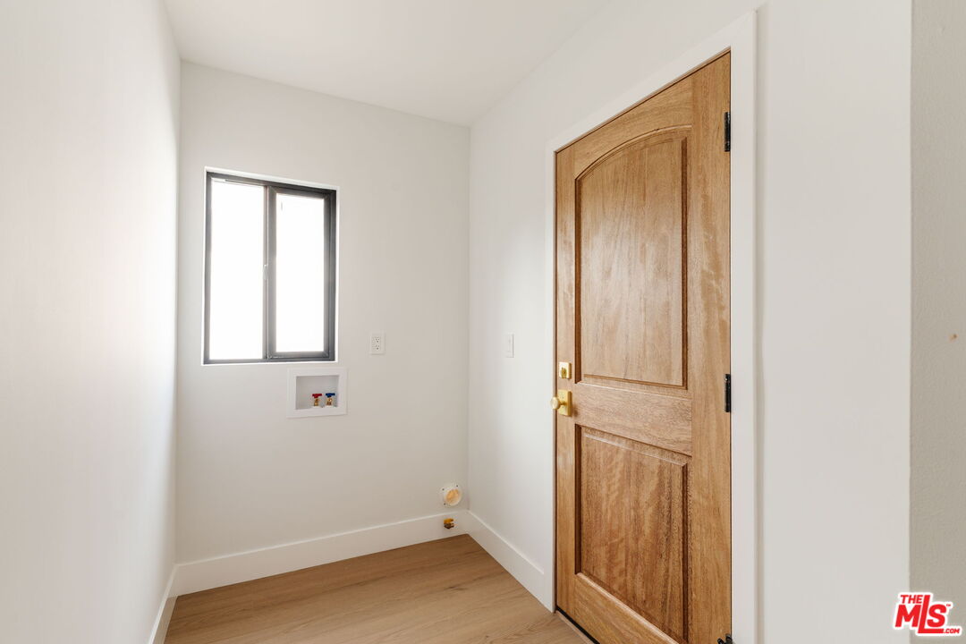 5168 Southridge Avenue Los Angeles, CA 90043 - Photo 47 of 74 a view of a hallway with wooden floor