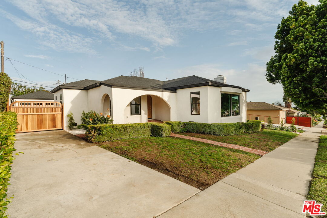 5168 Southridge Avenue Los Angeles, CA 90043 - Photo 62 of 74 a front view of a house with a yard