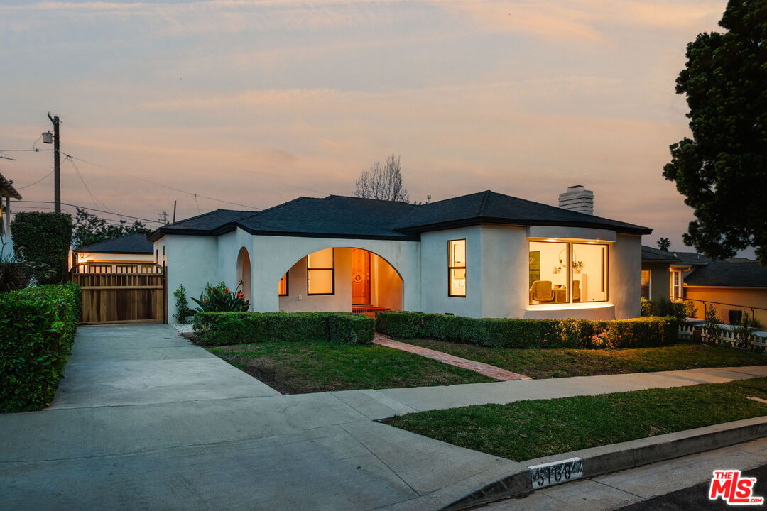 5168 Southridge Avenue Los Angeles, CA 90043 - Photo 68 of 74 a front view of a house with a yard and garage