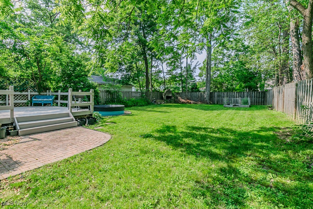 5195 Mayview Road Cleveland, OH 44124 - Photo 5 of 49 Fenced backyard featuring a deck fireplace and stock tank pool