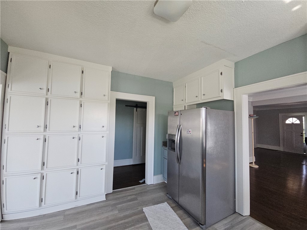 208 Pendleton Street Pickens, SC 29671 - Photo 11 of 30 This spacious kitchen offers ample storage and modern appliances.