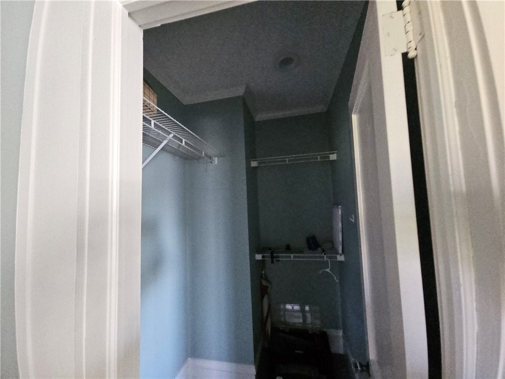 208 Pendleton Street Pickens, SC 29671 - Photo 19 of 30 This closet offers practical storage solutions with shelving for organization.