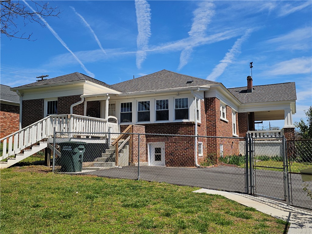 208 Pendleton Street Pickens, SC 29671 - Photo 2 of 30 This brick residence features a spacious rear yard, offering both privacy and ample outdoor living space.