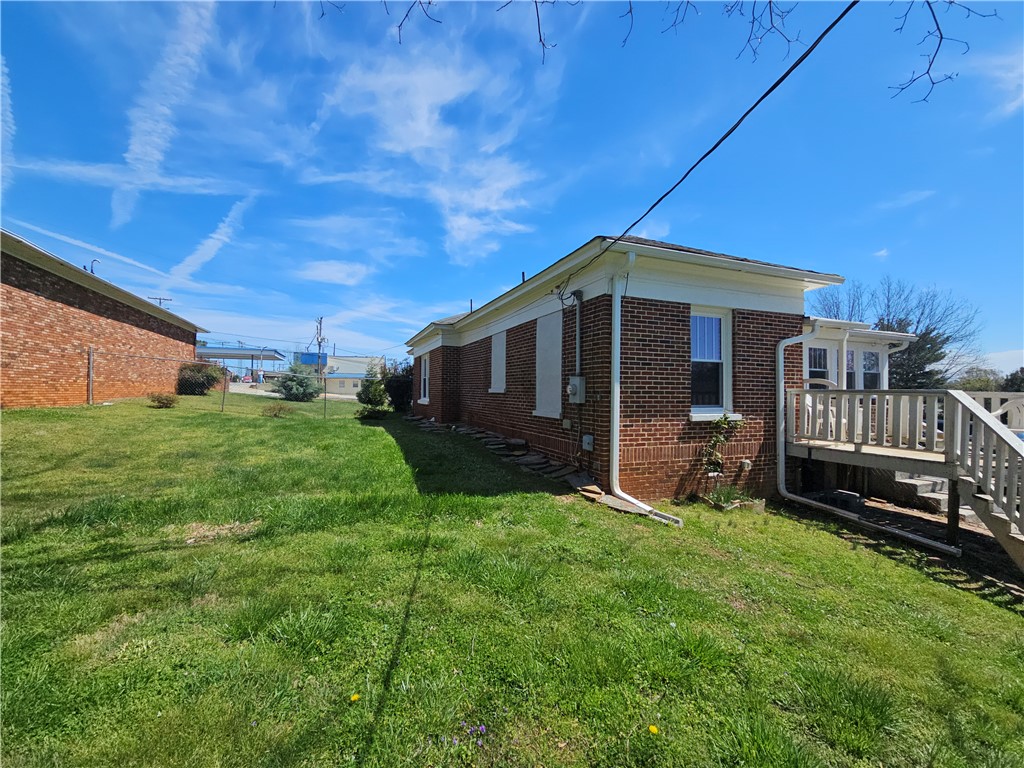 208 Pendleton Street Pickens, SC 29671 - Photo 5 of 30 This classic brick residence features a spacious yard and a charming side deck, perfect for outdoor living.