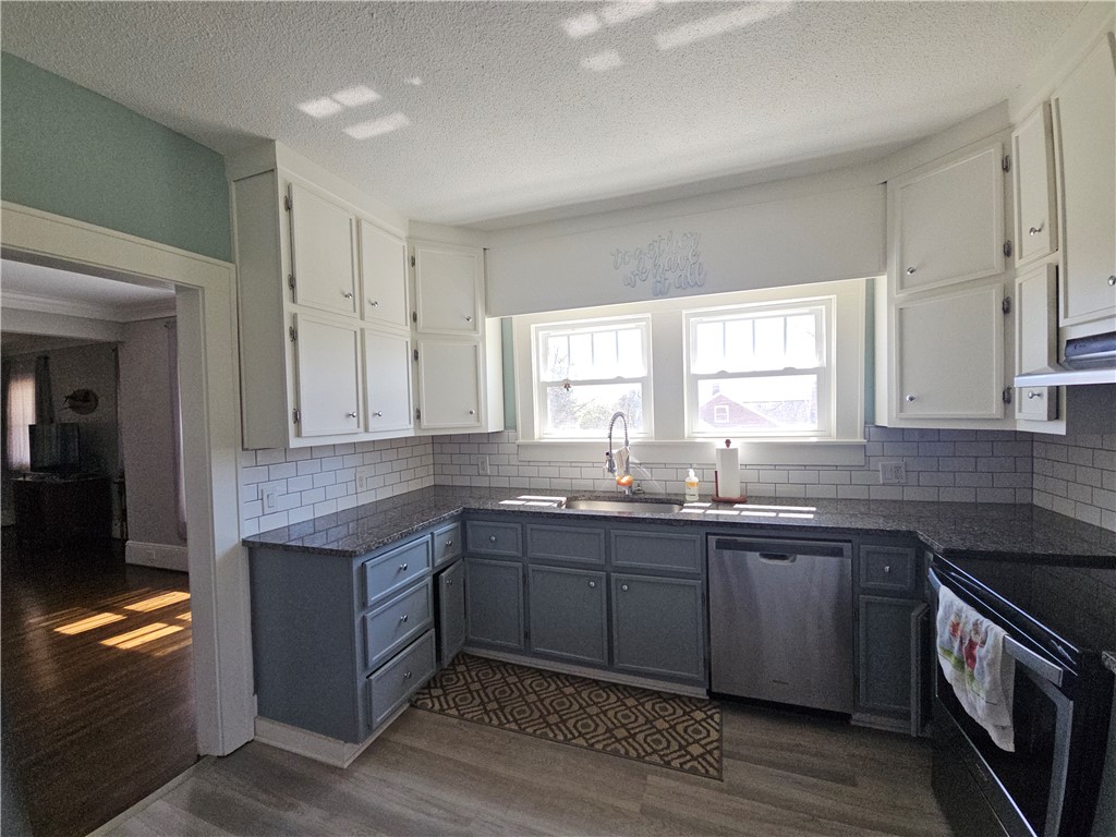 208 Pendleton Street Pickens, SC 29671 - Photo 7 of 30 This bright kitchen features ample cabinetry and sleek countertops.