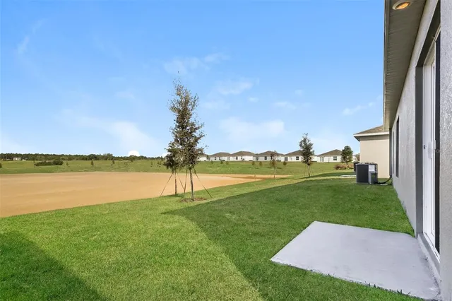 a view of a lake with a big yard