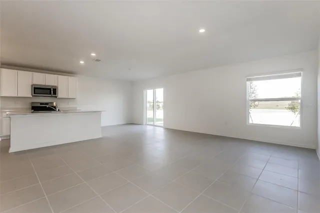 a view of a kitchen with a sink dishwasher and a microwave