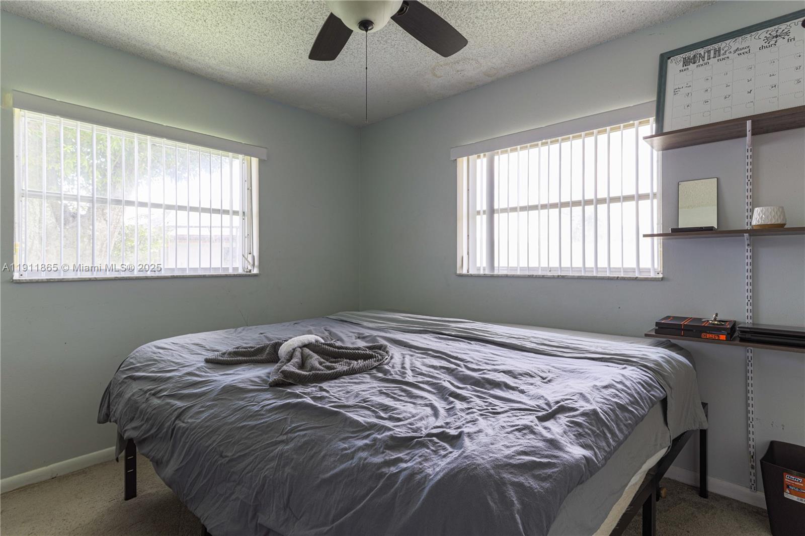 7940 Northwest 9th Street Margate, FL 33063 - Photo 11 of 21 a bedroom with a bed and a window