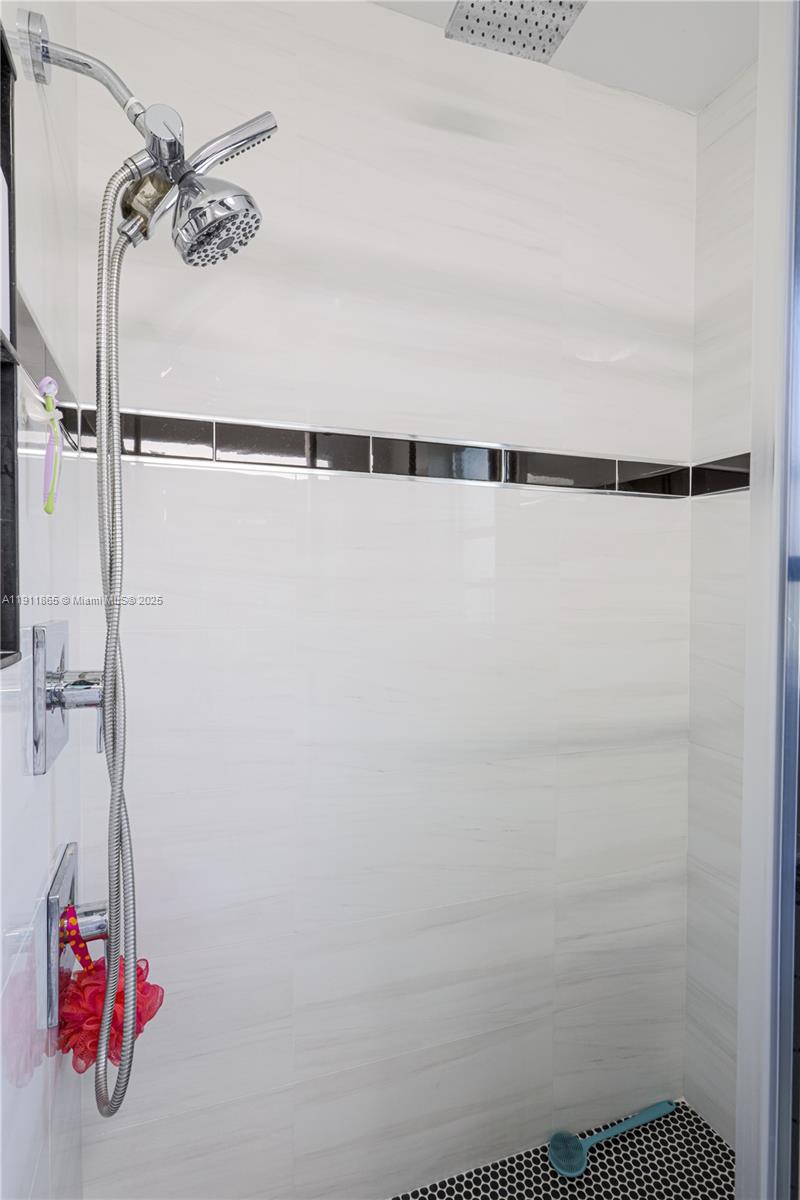 7940 Northwest 9th Street Margate, FL 33063 - Photo 18 of 21 a bathroom with a shower