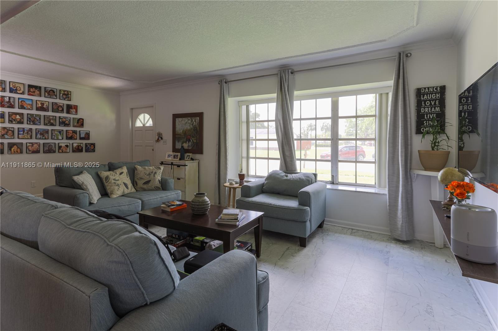 7940 Northwest 9th Street Margate, FL 33063 - Photo 4 of 21 a living room with furniture and a window