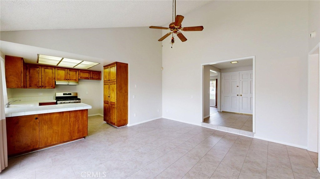 3415 Valencia Hill Drive Riverside, CA 92507 - Photo 16 of 48 a view of a kitchen with a sink and a refrigerator