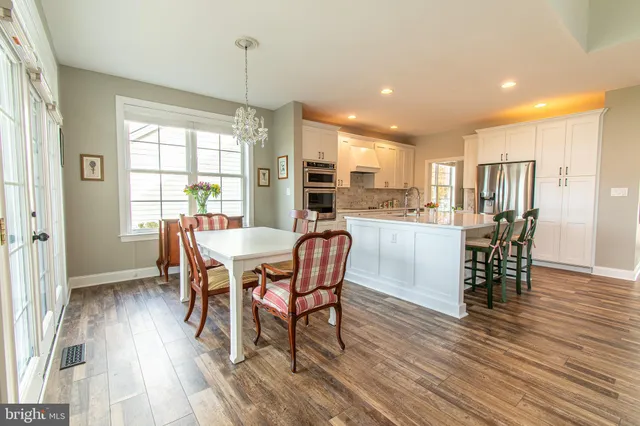 a living room with furniture fireplace and a table