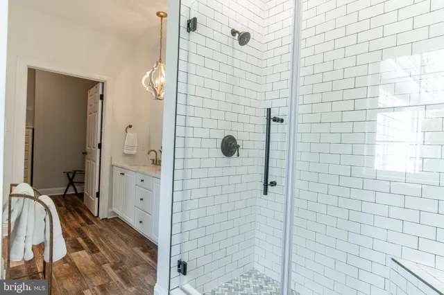 a white toilet sitting next to a bathroom sink