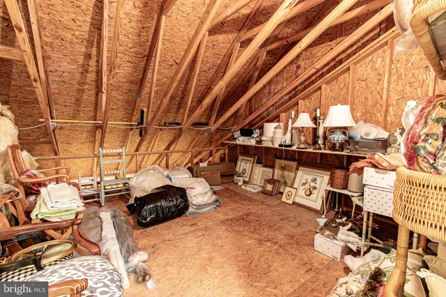 a view of house with seating space and potted plants