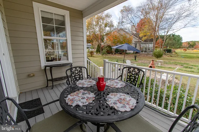 a view of a lake with houses in the back