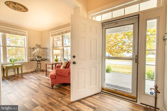a large white kitchen with a large window
