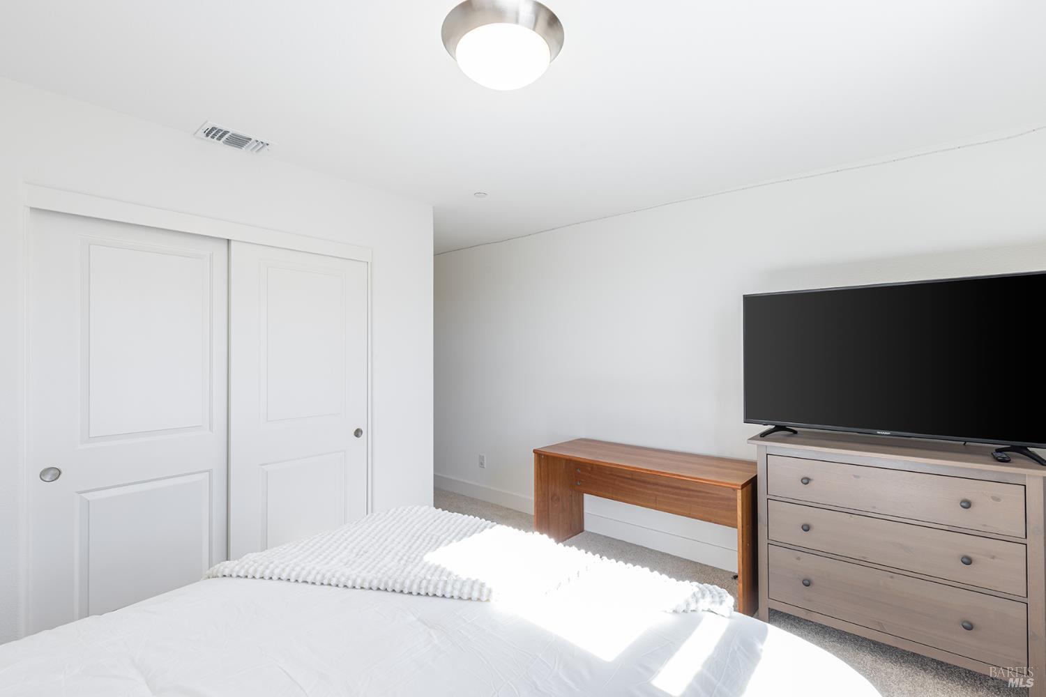 6092 Oak Leaf Place Rohnert Park, CA 94928 - Photo 31 of 39 a bedroom with a bed and flat screen tv