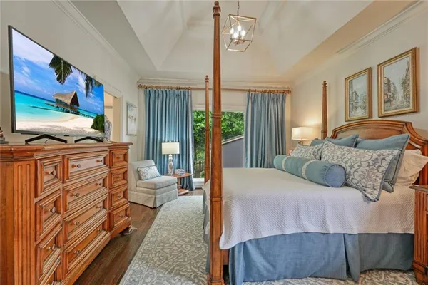 a bedroom with furniture and large window